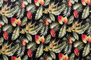 Close-up of Multicolor Palm Leaves Upholstery Cotton Fabric with a tropical botanical print including exotic foliage and floral elements in shades of teal, orange, and green.