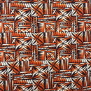Rusty Orange colored Polynesian Tribal Bloom Polyester Poplin Fabric